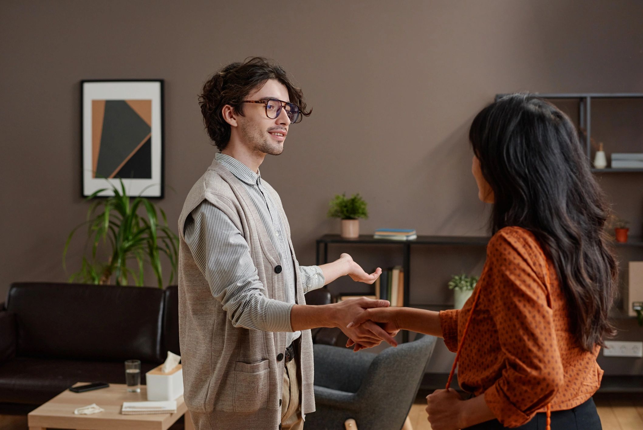 Two professionals shaking hands to mark a partnership
